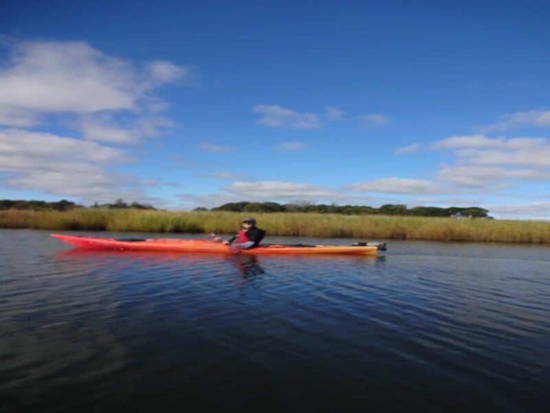 a man in a red kayak