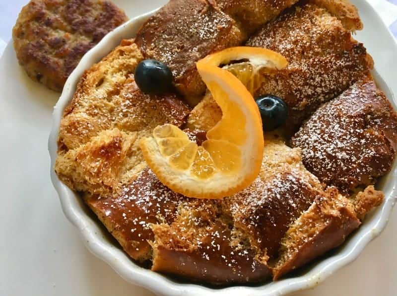 Orange bread pudding with a side of sausage