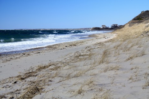 a beach with white capped waves