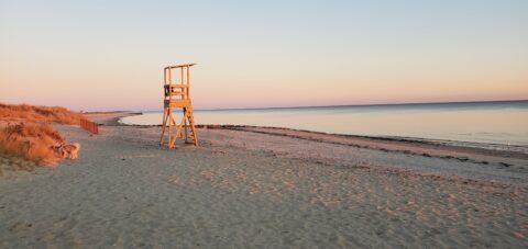 Earl Road Beach in West Harwich with the life guard chair at Sunset