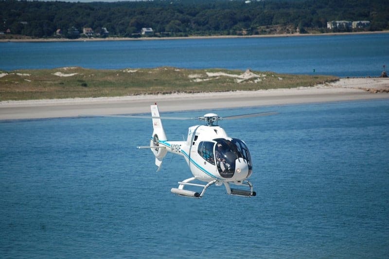 Helicopter flying over the water