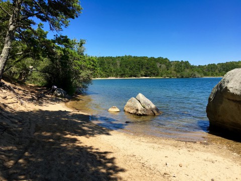 a kettle pond swimming hole with large boulders