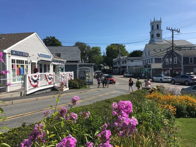 A street in Chatham showing stores and people walking