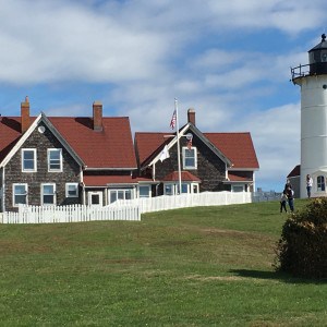 Nobska lighthouse. A brown building with red roofs