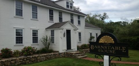 The exterior of Barnstable house.  A white clapboard building