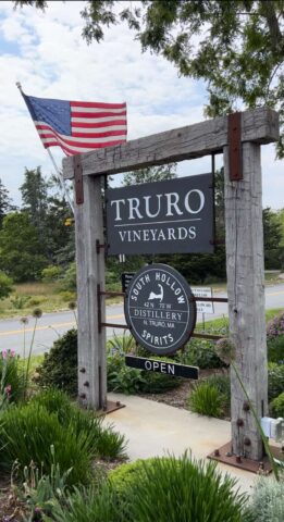 Entrance sign to Truro Vineyards with an American Flag